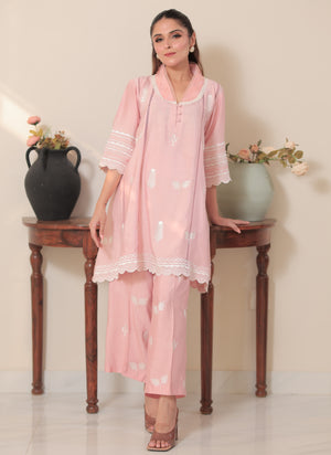 Blush pink 2-piece khadi silk suit with delicate white threadwork, lace borders, and matching wide-leg pants