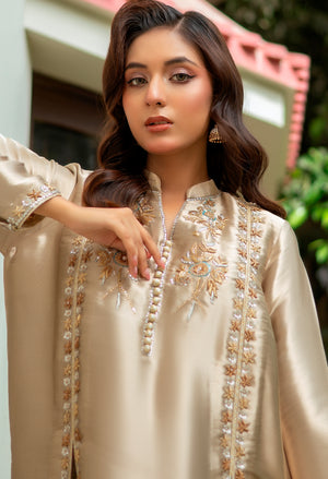 Model wearing Aurum 3-piece outfit featuring hand-embroidered lama silk shirt, velvet embroidered pants, and pure silk dupatta with gota detailing