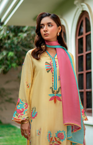 Model wearing Mango Sorbet khaddi silk outfit in mango yellow with multicolor embroidery and ombré pink-blue silk dupatta