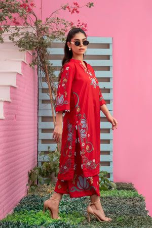 Elegant red breathable fabric kurta and trousers with intricate printed motifs
