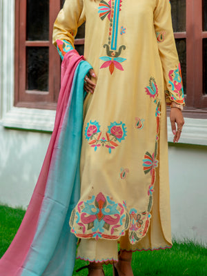 Embroidered yellow khaddi silk shirt with matching pants and ombré dupatta in pink and aqua blue