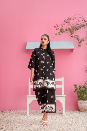 Breathable black summer fabric with bold monochrome floral detailing