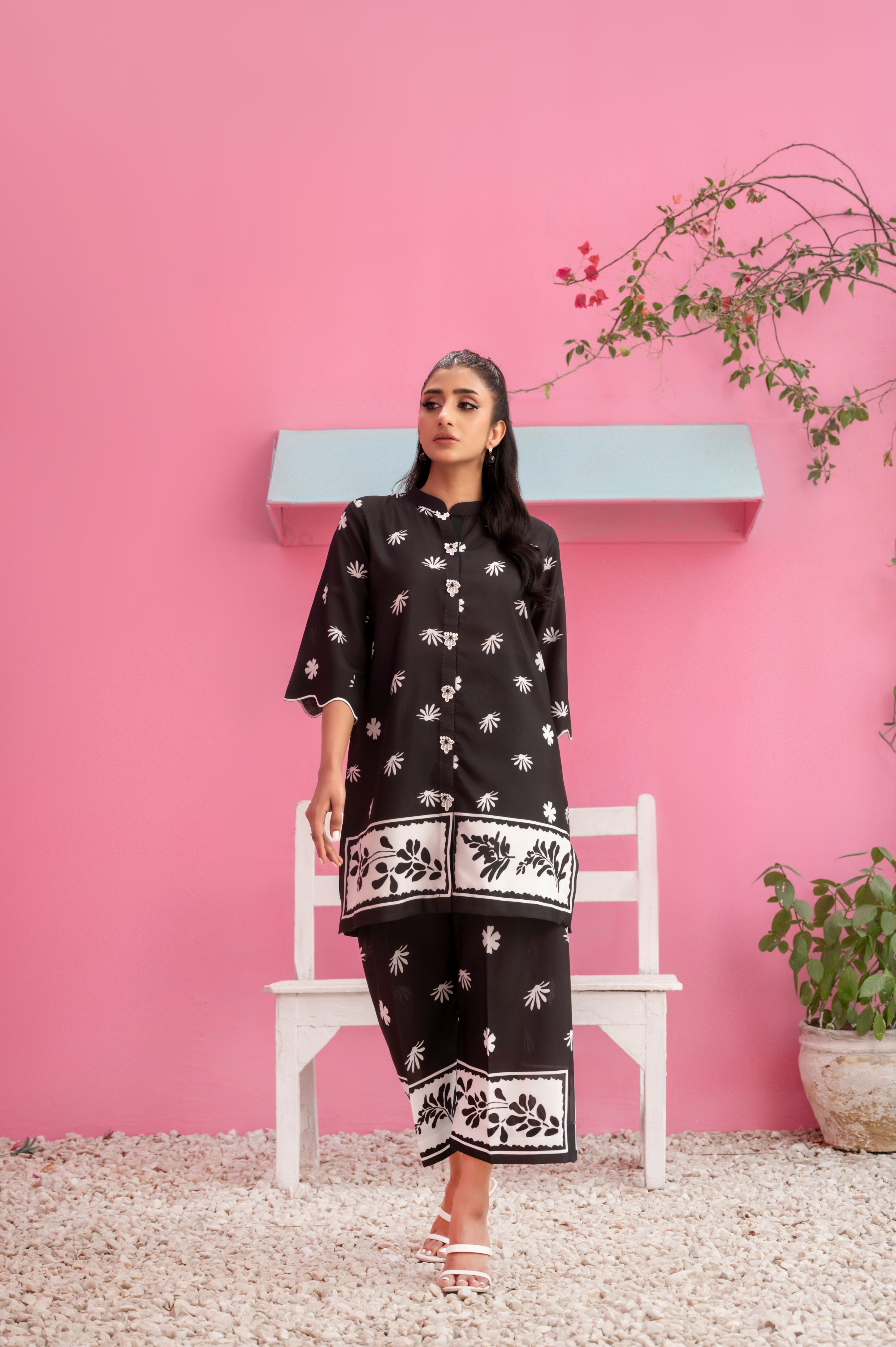 Breathable black summer fabric with bold monochrome floral detailing