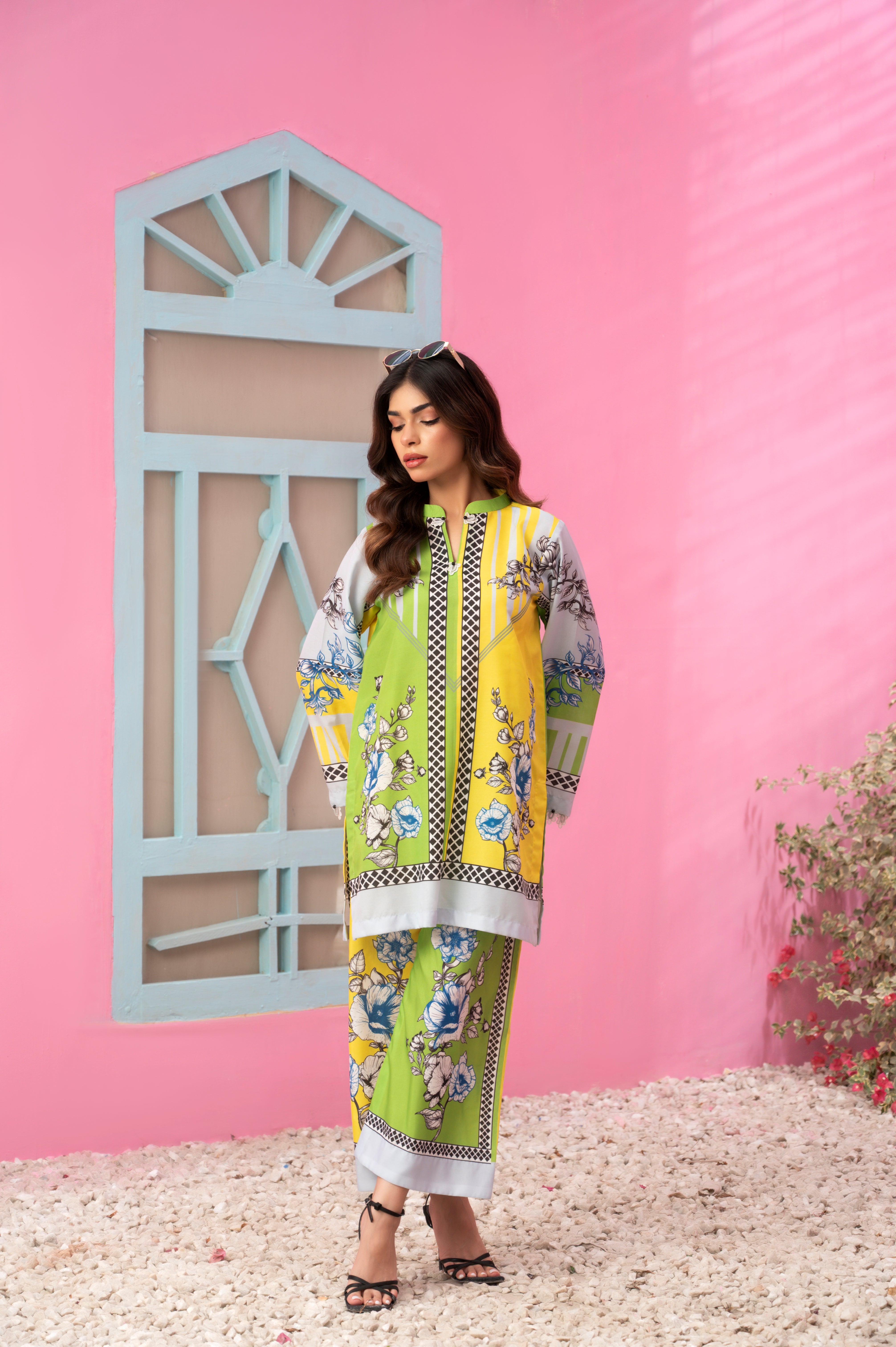 Breathable summer fabric with vibrant citrus tones and floral detailing