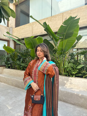 Crafted in pure self sheesha silk, Cinnamon Mocha features colourful, delicate machine embroidery that adds vibrance and charm.