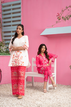 Elegant two-piece summer dress with floral motifs and vibrant red trousers