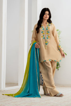Model wearing 3-piece Kafe ensemble in beige pure Sheesha silk with aqua and yellow hand embroidery, handcrafted tassels, and dual-tone silk dupatta with lace detailing