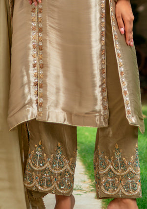 Model wearing gold-toned 3-piece formal dress in lama silk and velvet with intricate embroidery and gota detailing